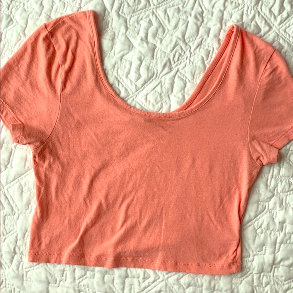 Pink/salmon colored crop top
